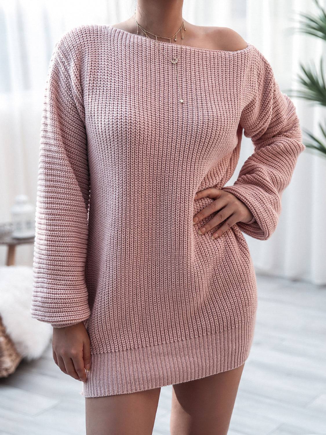 a woman wearing a pink sweater dress