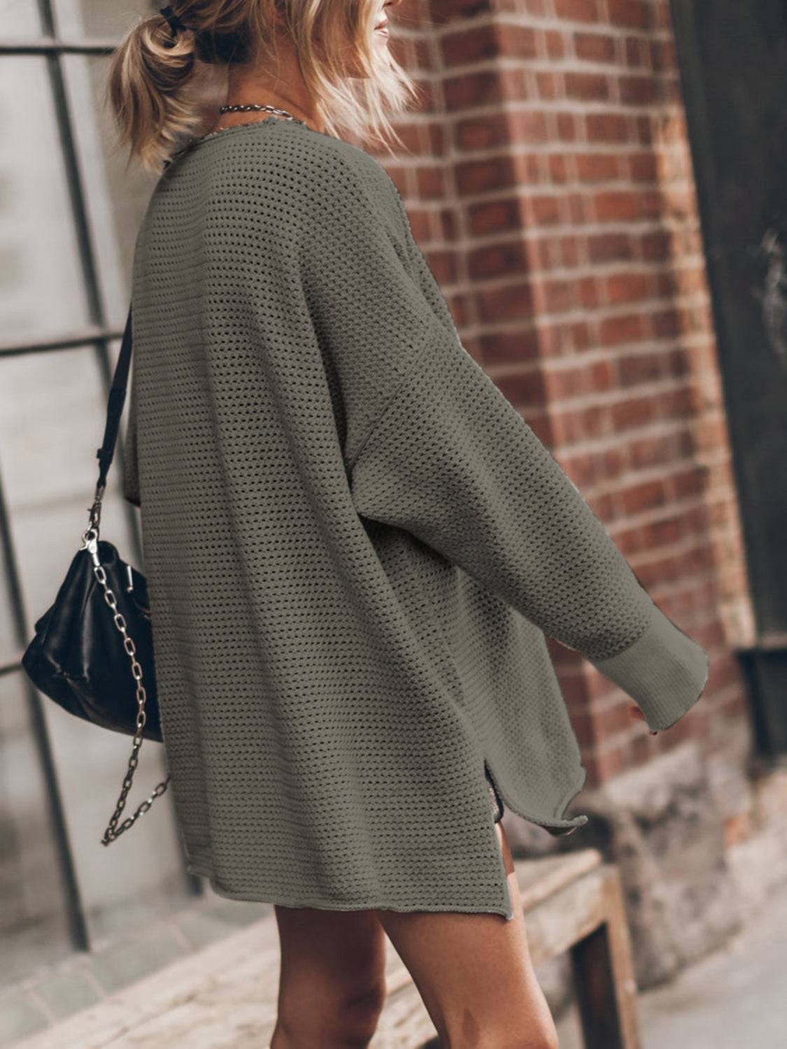 a woman walking down the street with a handbag